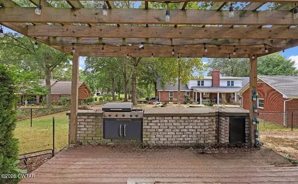 a view of a chairs and table on the deck