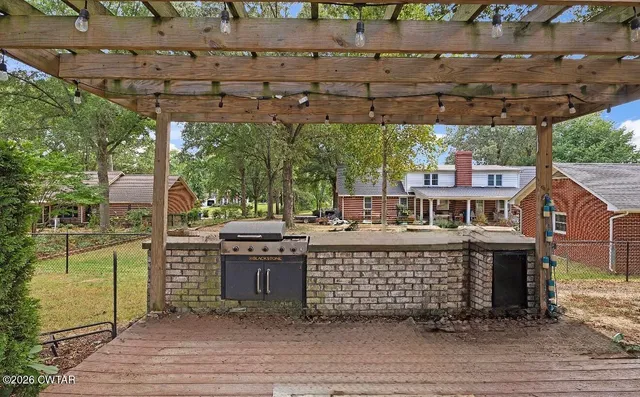 a view of a chairs and table on the deck