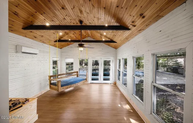 a view of a patio with wooden floor