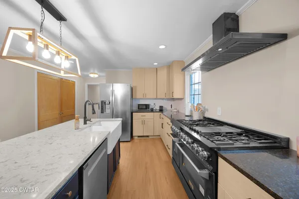 a kitchen with a stove and a sink