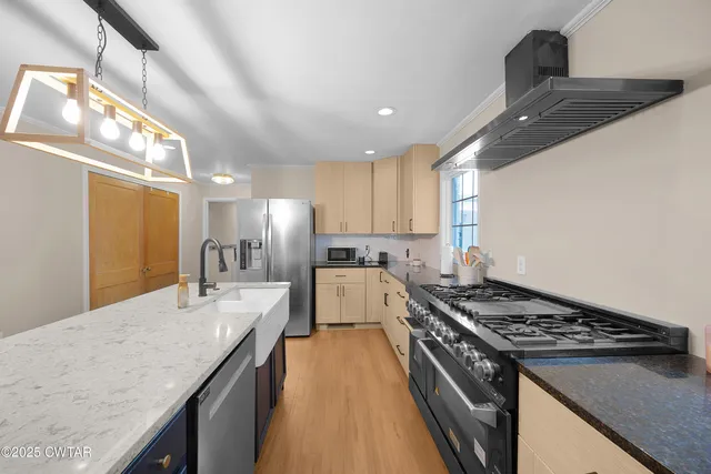a kitchen with a stove and a sink