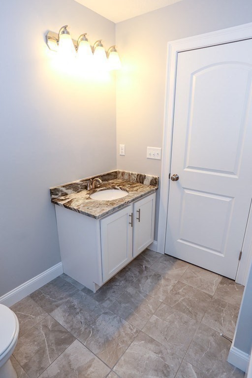 Lot 197 Stowell Road Ashburnham, MA 01430 - Photo 21 of 42 a bathroom with a sink and vanity