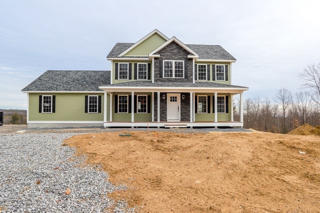Lot 197 Stowell Road Ashburnham, MA 01430 - Photo 3 of 42 a front view of a house with a garden