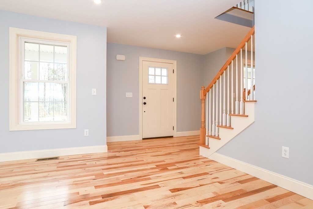Lot 197 Stowell Road Ashburnham, MA 01430 - Photo 38 of 42 an empty room with wooden floor and windows