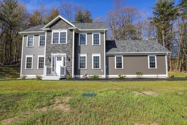 Lot 197 Stowell Road Ashburnham, MA 01430 - Photo 40 of 42 a front view of a house with a yard