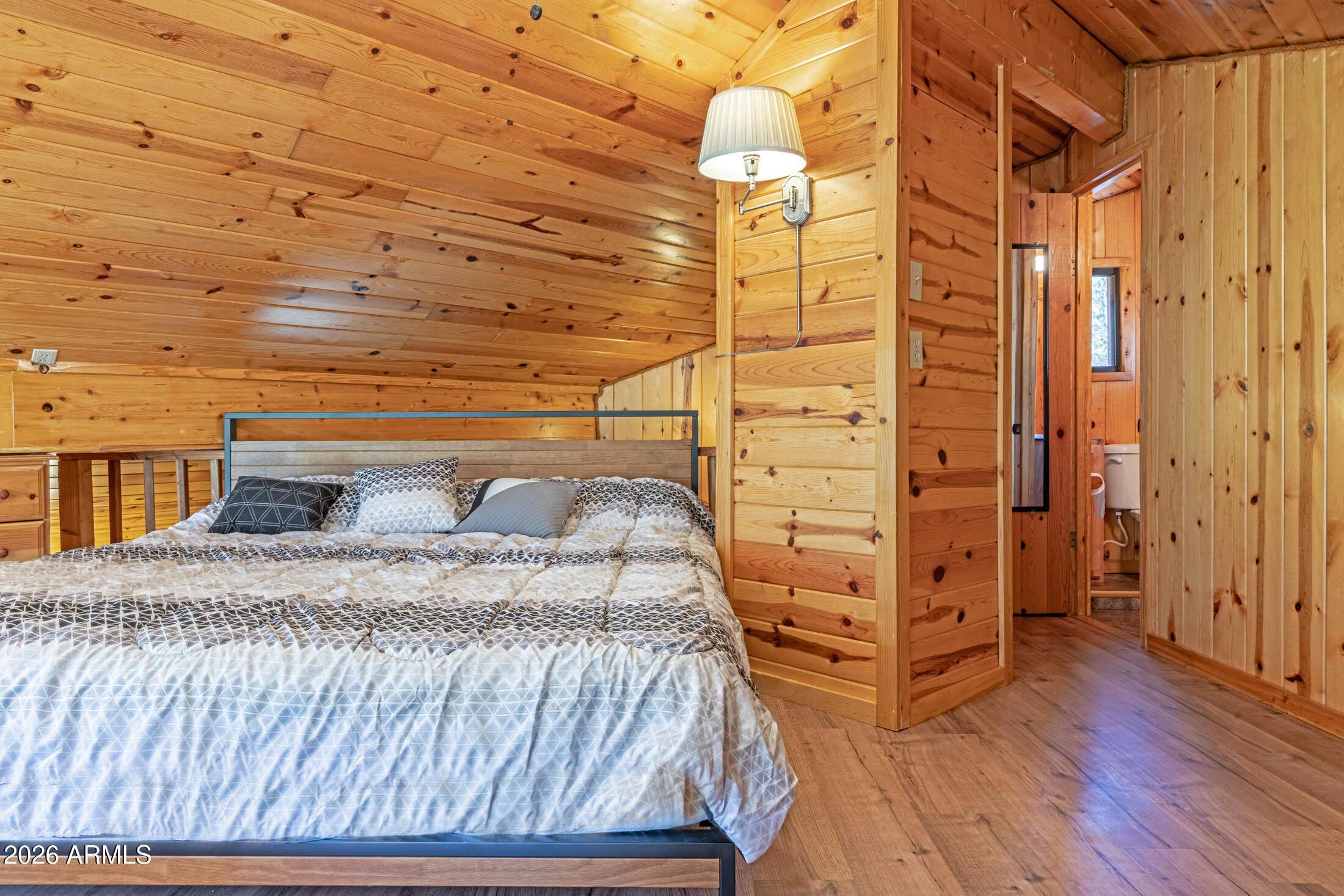 190 South Greystone Circle Payson, AZ 85541 - Photo 28 of 45 a bedroom with a bed and wooden floor