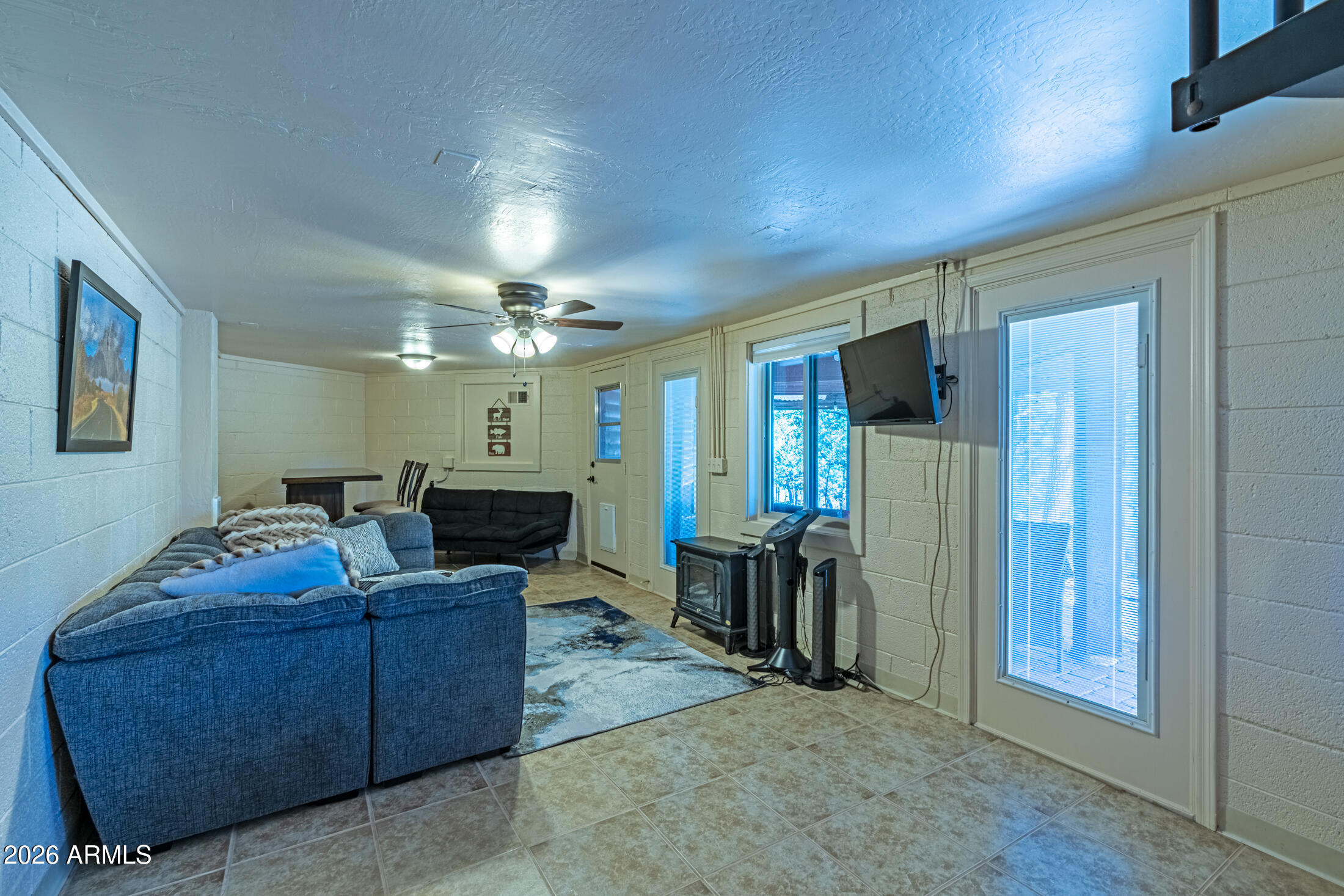 190 South Greystone Circle Payson, AZ 85541 - Photo 30 of 45 a living room with furniture a large window and chandelier