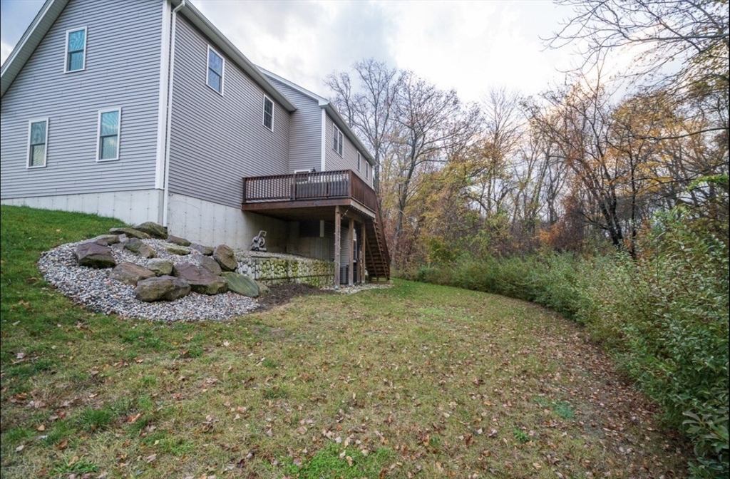 23 Ralph Street Chicopee, MA 01020 - Photo 39 of 42 a view of a house with a large tree and a yard