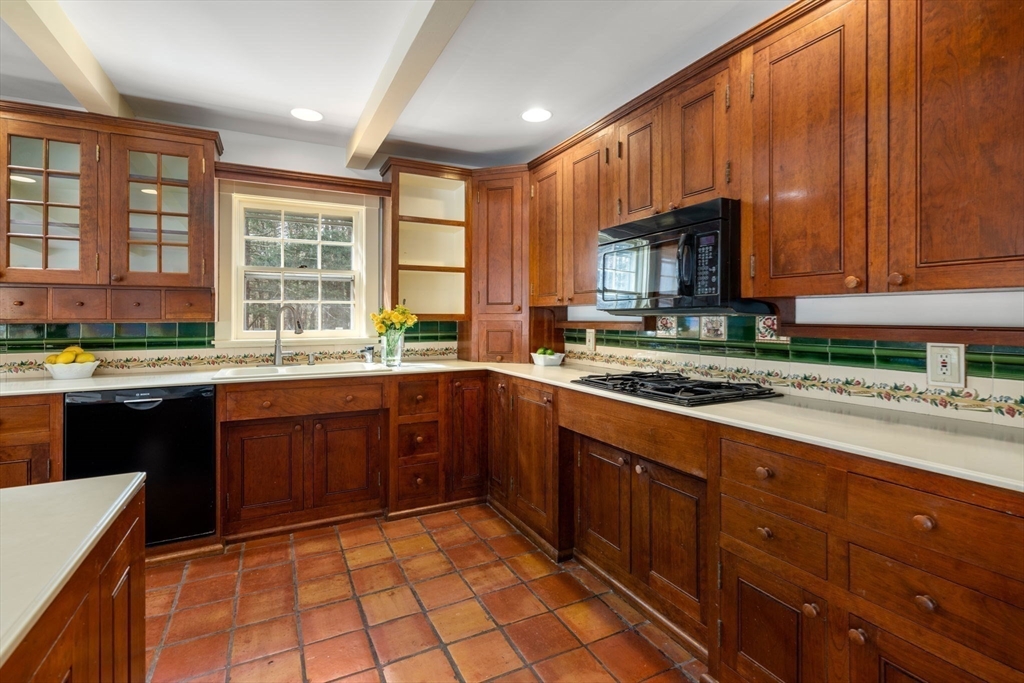 397 Concord Road Weston, MA 02493 - Photo 8 of 35 a kitchen with stainless steel appliances granite countertop a stove sink and cabinets