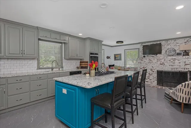 a kitchen with sink cabinets and window