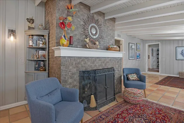 a kitchen with granite countertop white cabinets and a sink