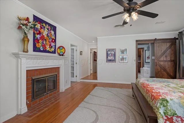 a bedroom with furniture and a book shelf