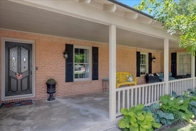 a view of a house with a small yard