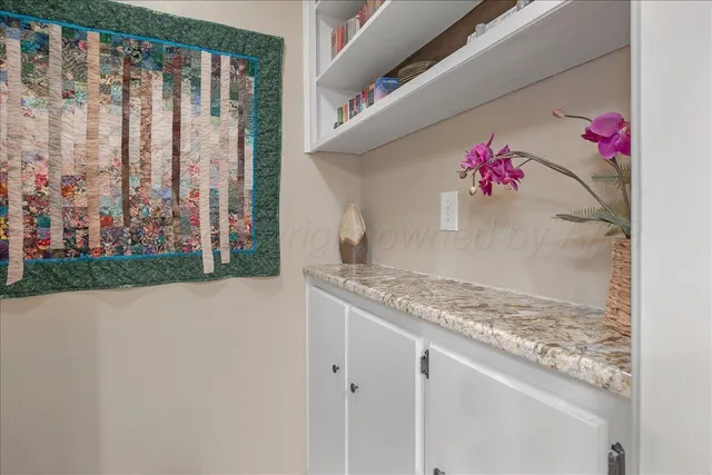 a bathroom with a sink and a window