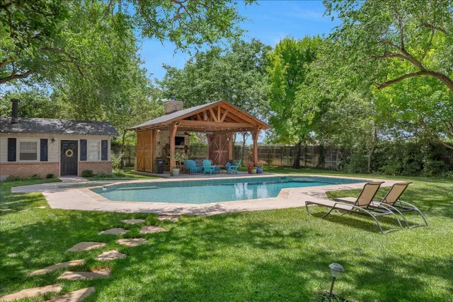 a terrace of a house with outdoor seating