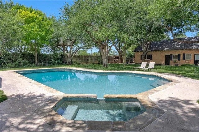 a front view of house with yard and outdoor seating
