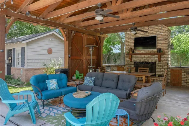 a view of a house with a big yard and large trees