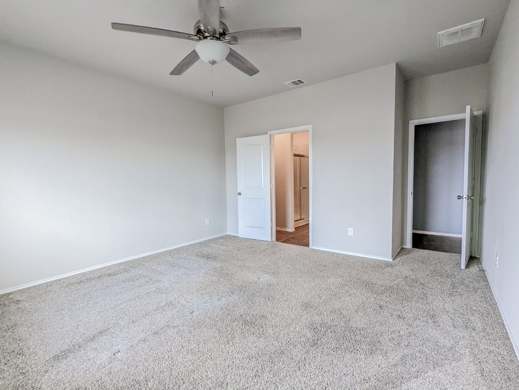 14541 Montclair Way Magnolia, TX 77354 - Photo 13 of 31 a view of an empty room and a ceiling fan
