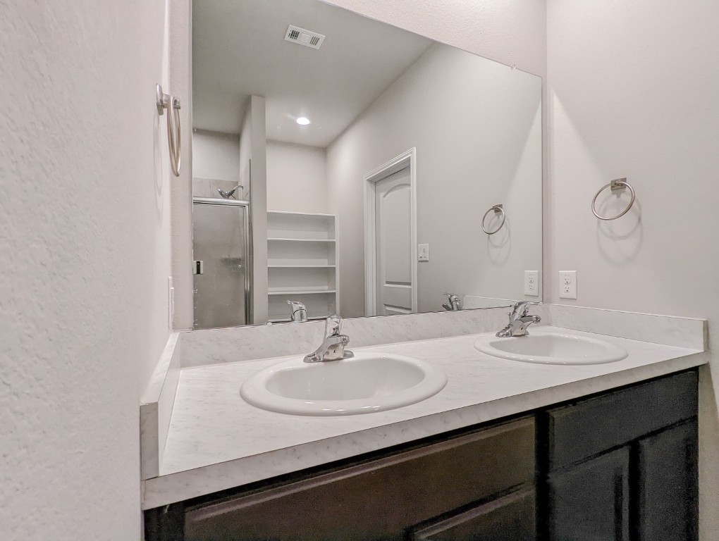 14541 Montclair Way Magnolia, TX 77354 - Photo 14 of 31 a bathroom with a sink and a mirror