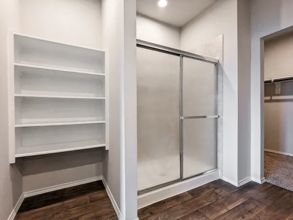 a view of an empty walk in closet