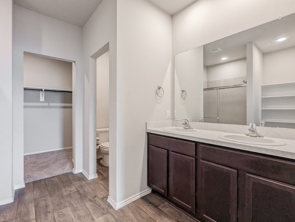 14541 Montclair Way Magnolia, TX 77354 - Photo 16 of 31 a bathroom with a double vanity sink and a mirror