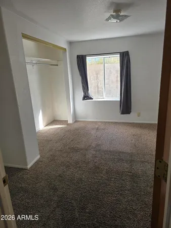 a view of empty room with windows