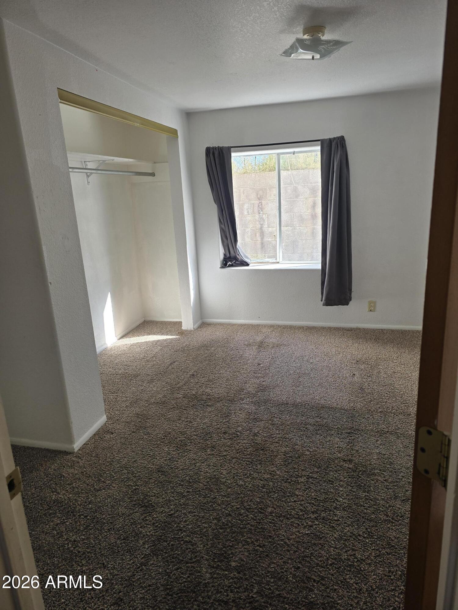 360 West Bailey Street Globe, AZ 85501 - Photo 2 of 11 a view of empty room with windows