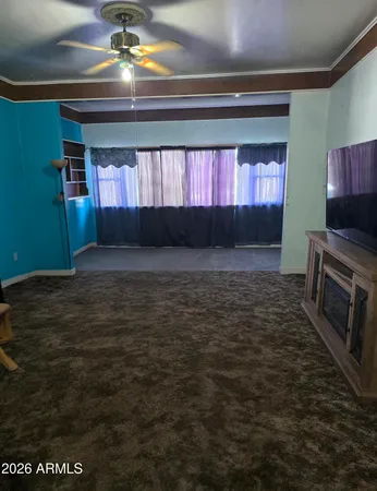 a view of an empty room with a window