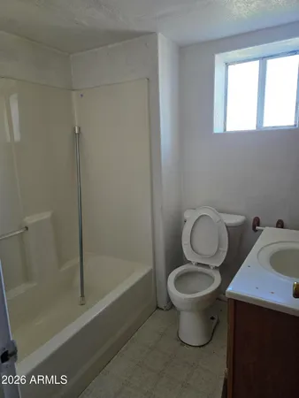 a bathroom with a toilet and a sink