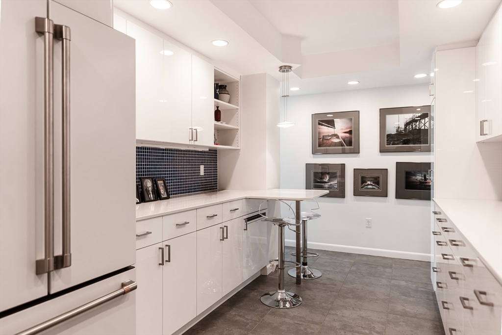 1010 Memorial Drive, Unit 6G Cambridge, MA 02138 - Photo 19 of 22 a view of kitchen with stainless steel appliances cabinets and window