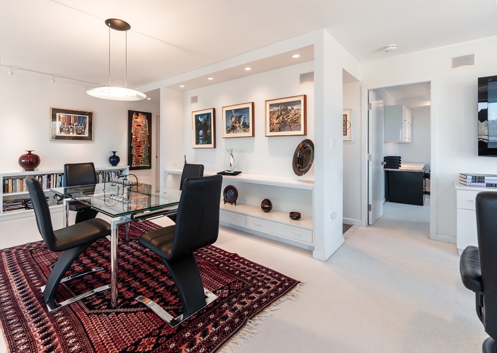 1010 Memorial Drive, Unit 6G Cambridge, MA 02138 - Photo 9 of 22 a living room with furniture and wooden floor