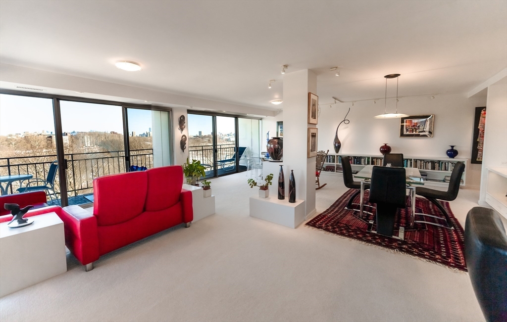 1010 Memorial Drive, Unit 6G Cambridge, MA 02138 - Photo 10 of 22 a living room with furniture and a large window