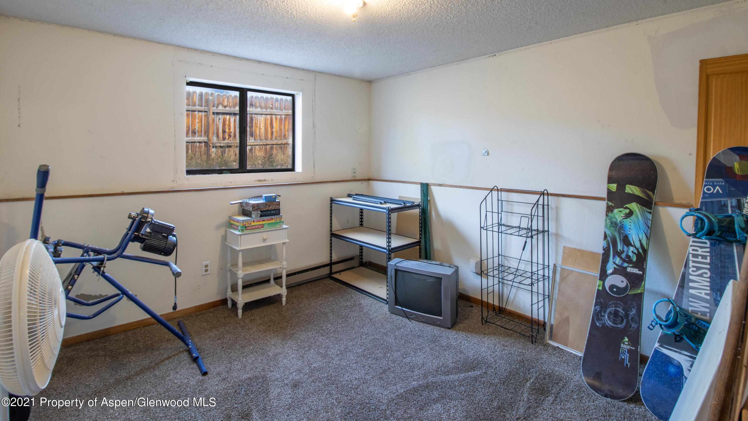 1002 Arnold Court Rifle, CO 81650 - Photo 11 of 15 a bedroom with furniture and a window