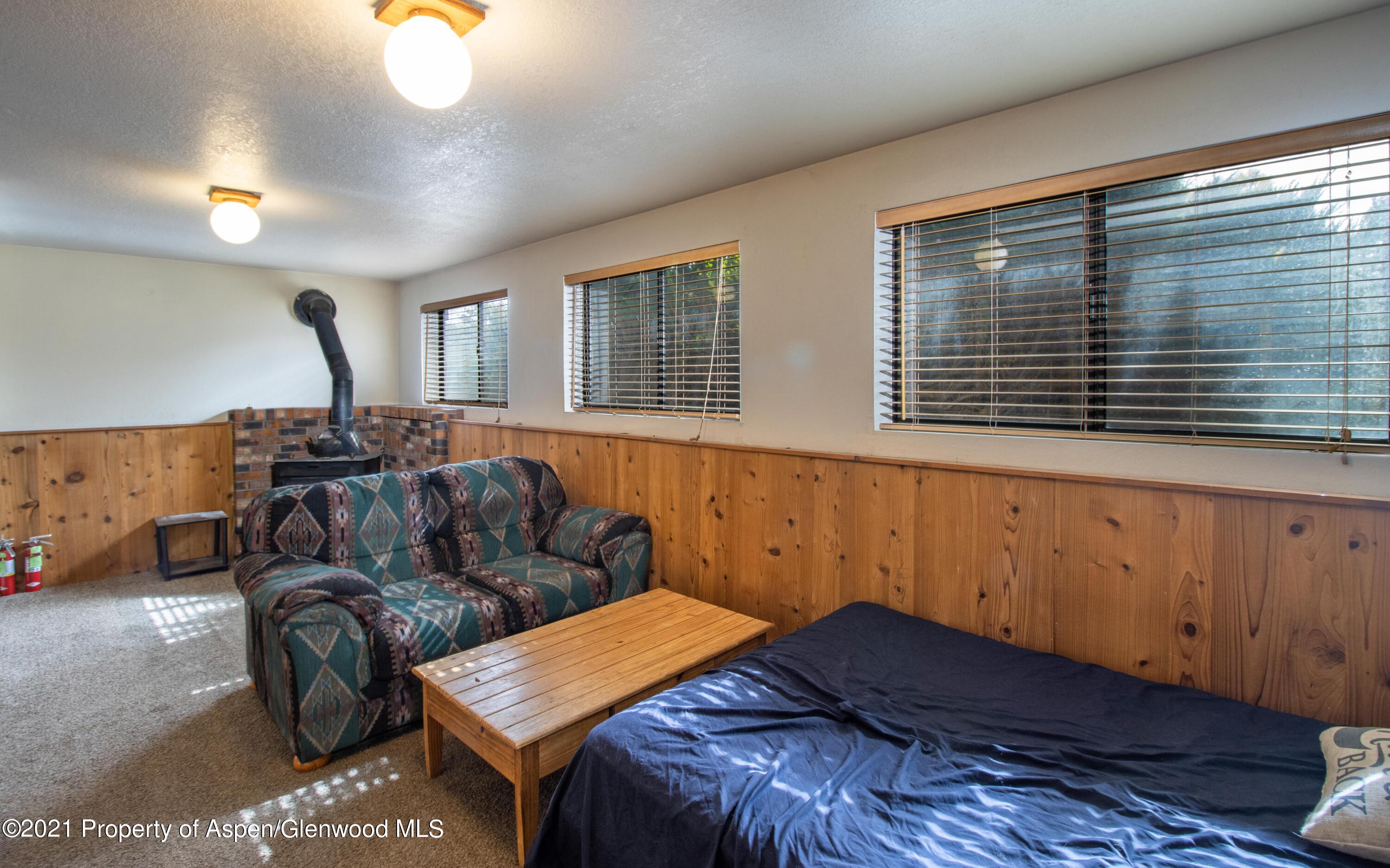 1002 Arnold Court Rifle, CO 81650 - Photo 13 of 15 a bedroom with a bed and window
