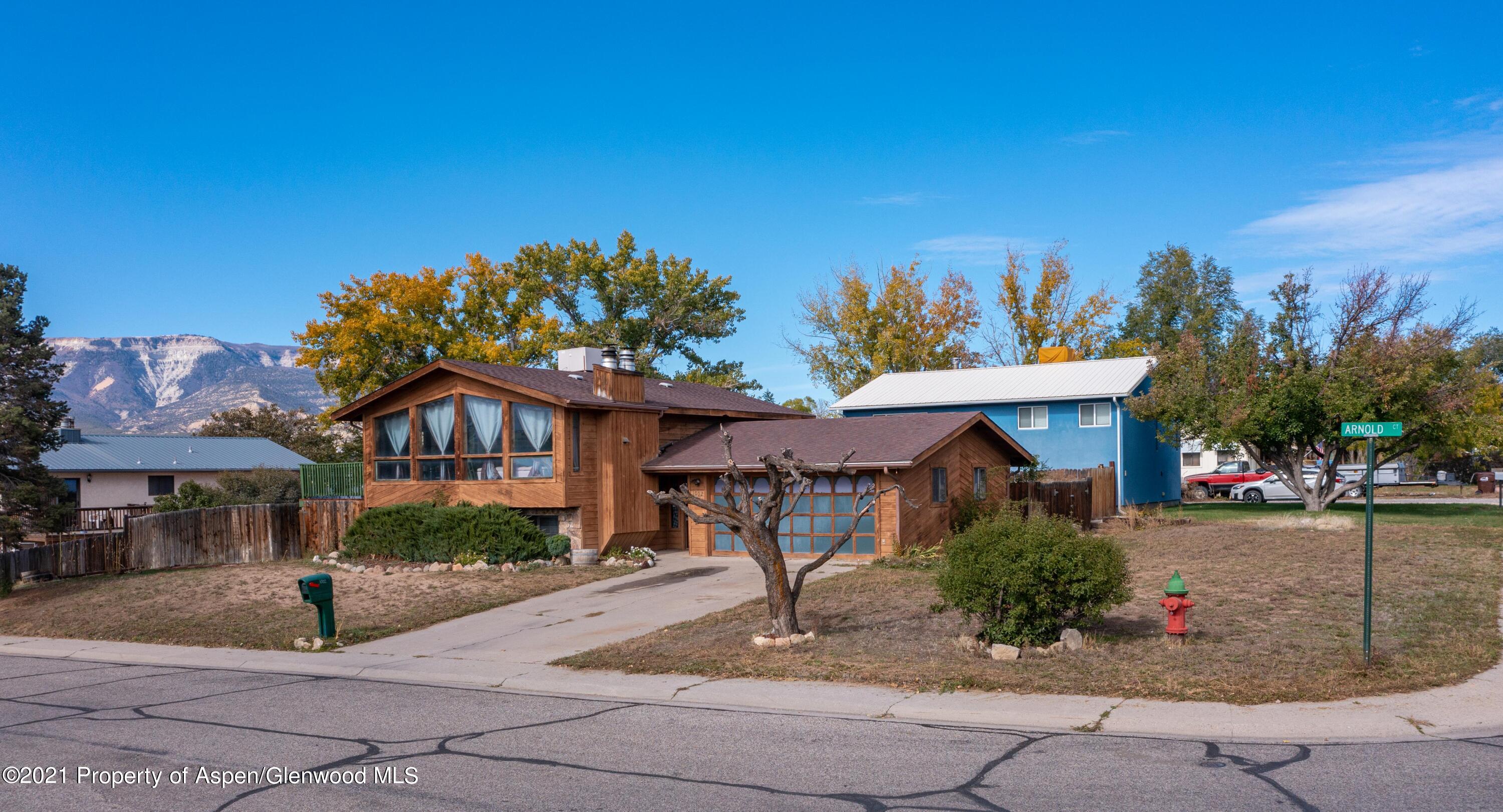 1002 Arnold Court Rifle, CO 81650 - Photo 2 of 15 a front view of a house with garden