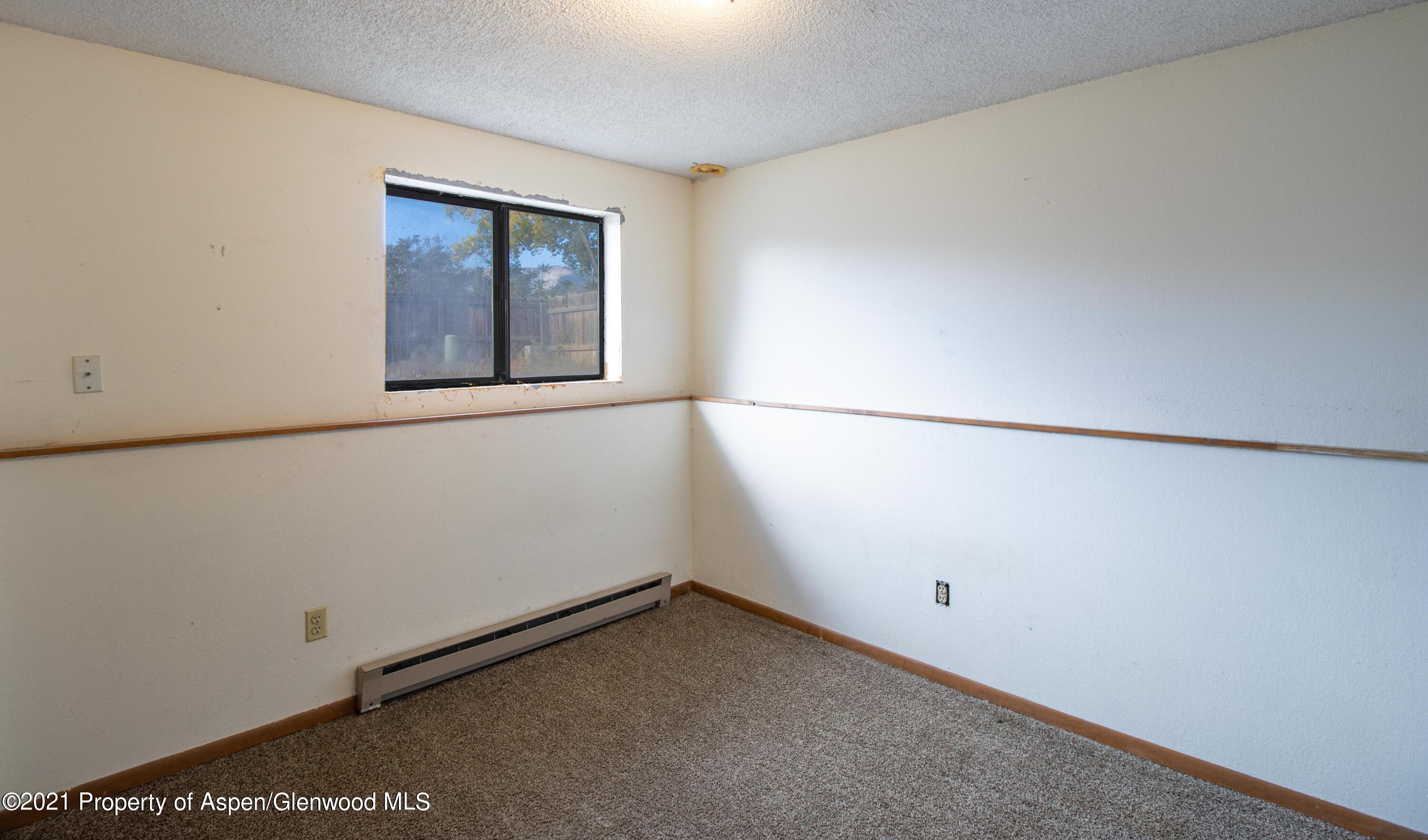 1002 Arnold Court Rifle, CO 81650 - Photo 10 of 15 an empty room with a window