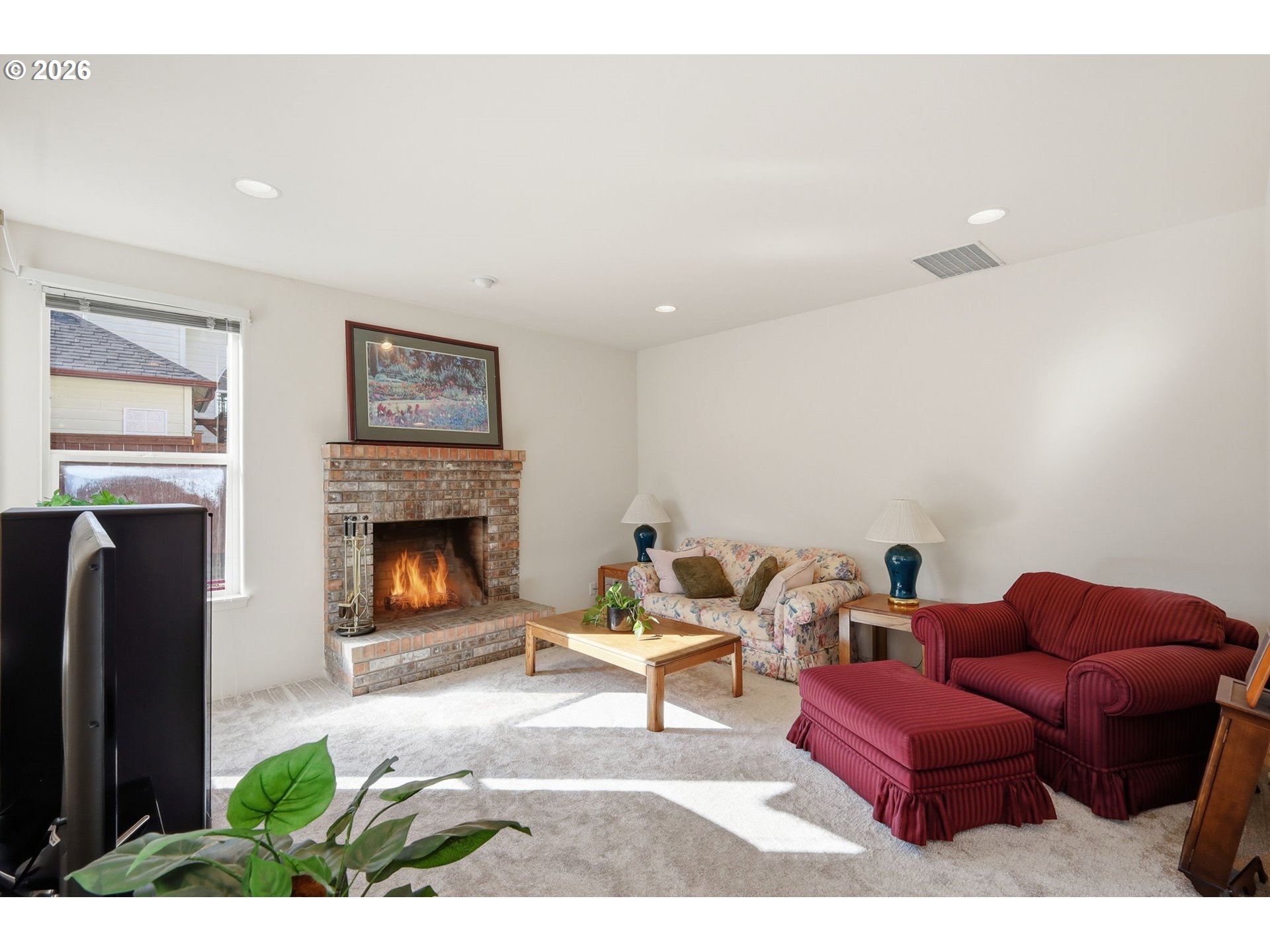 3379 South Lambert Street Eugene, OR 97405 - Photo 12 of 44 a living room with furniture and a fireplace