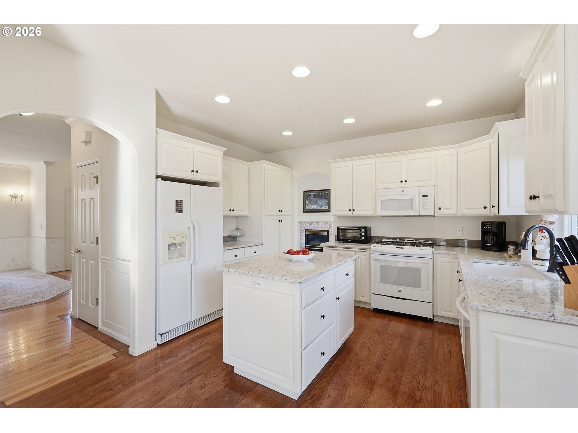 3379 South Lambert Street Eugene, OR 97405 - Photo 13 of 44 a kitchen with white cabinets and stainless steel appliances