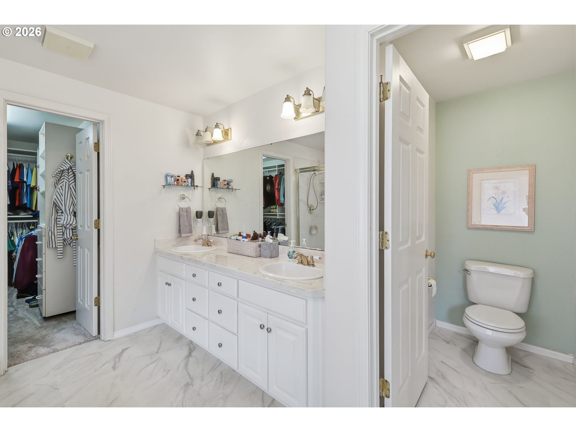 3379 South Lambert Street Eugene, OR 97405 - Photo 22 of 44 a bathroom with a toilet a sink a mirror and a shower