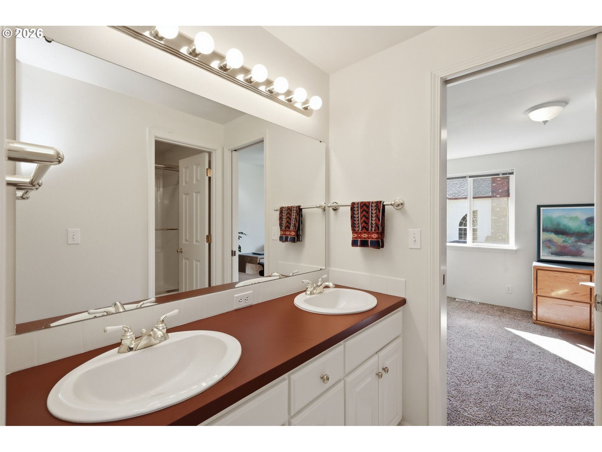 3379 South Lambert Street Eugene, OR 97405 - Photo 28 of 44 a bathroom with a sink double vanity and a mirror