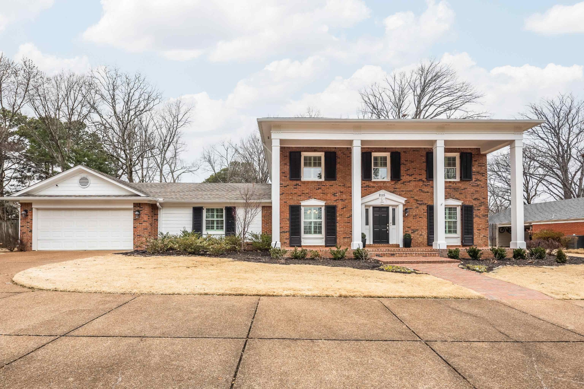 2115 Brierbrook Road Memphis, TN 38138 - Photo 1 of 40 a front view of a house with a yard