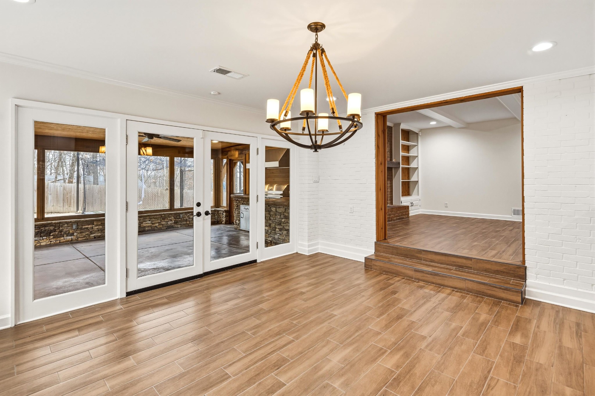2115 Brierbrook Road Memphis, TN 38138 - Photo 15 of 40 a view of empty room with wooden floor and fan