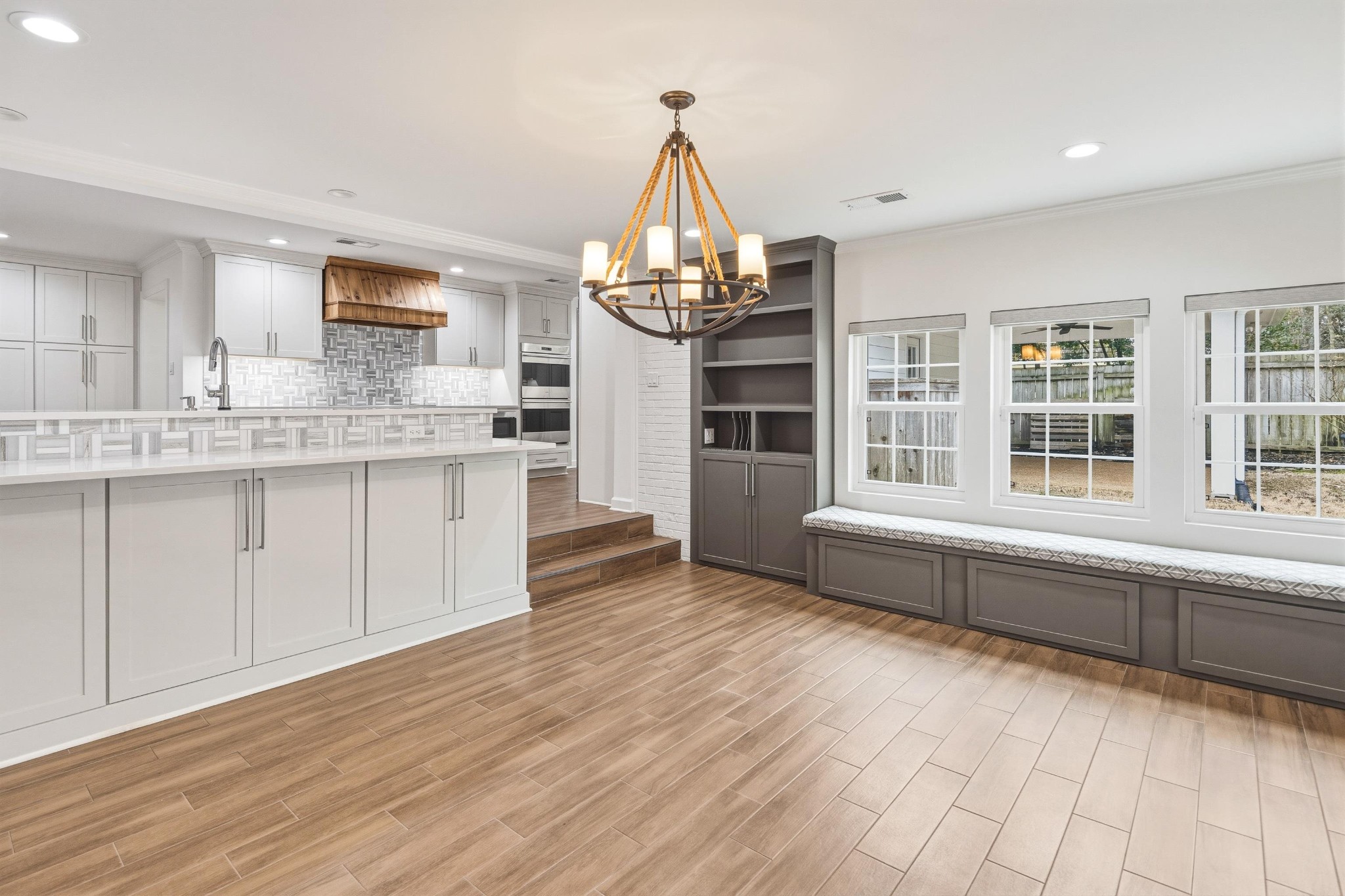 2115 Brierbrook Road Memphis, TN 38138 - Photo 16 of 40 a kitchen with stainless steel appliances a stove and wooden floor