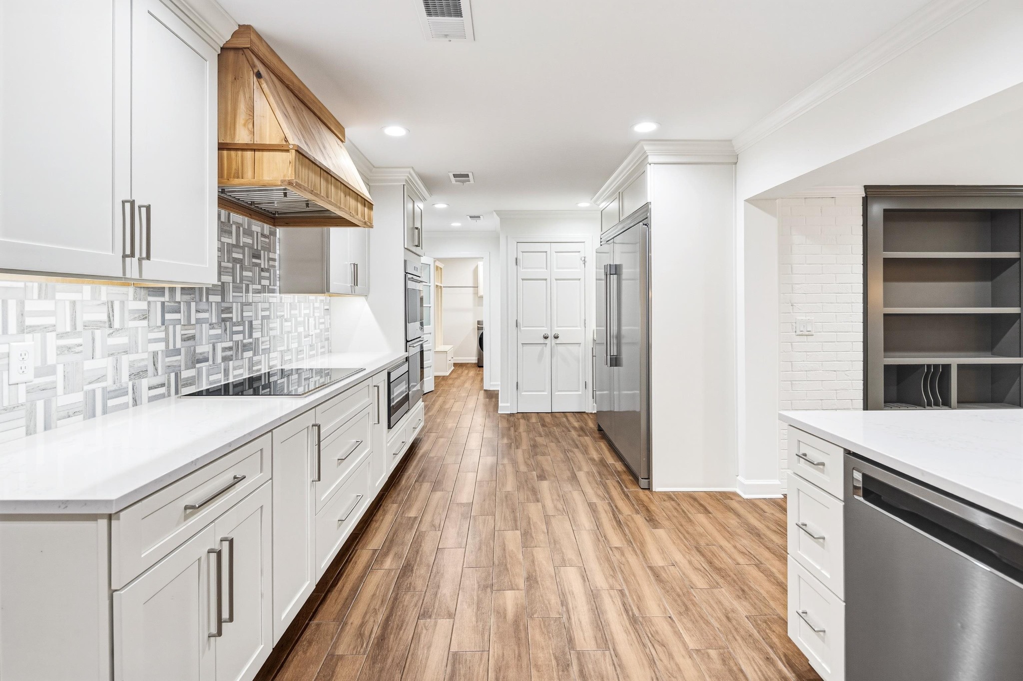 2115 Brierbrook Road Memphis, TN 38138 - Photo 18 of 40 a kitchen with granite countertop a sink a counter space appliances and cabinets