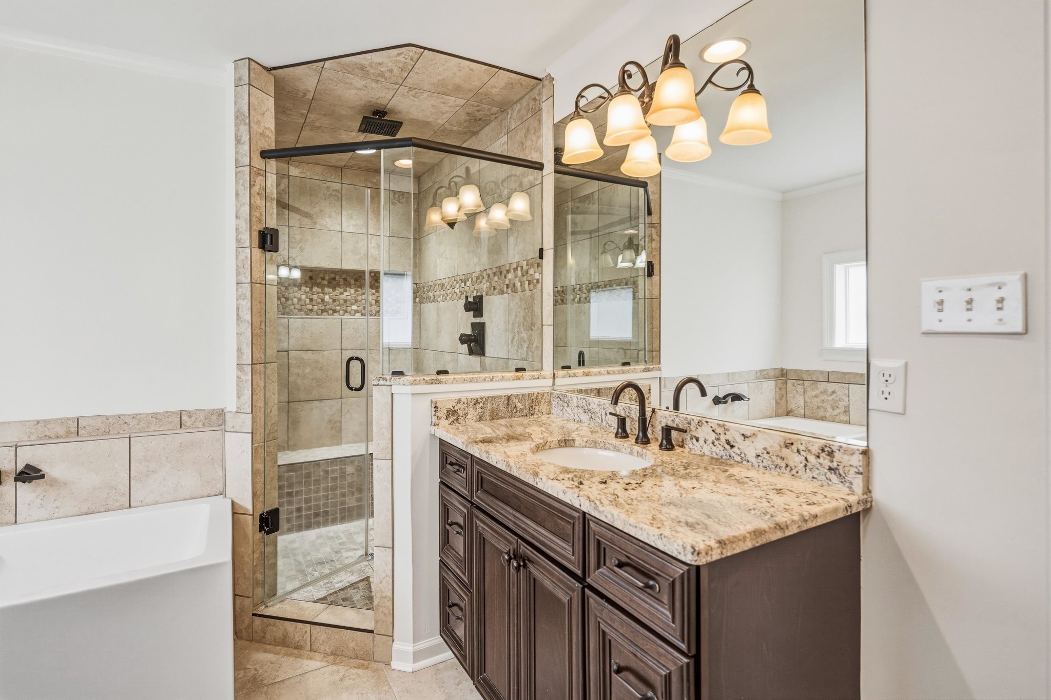 2115 Brierbrook Road Memphis, TN 38138 - Photo 24 of 40 a bathroom with a granite countertop sink a mirror and a shower