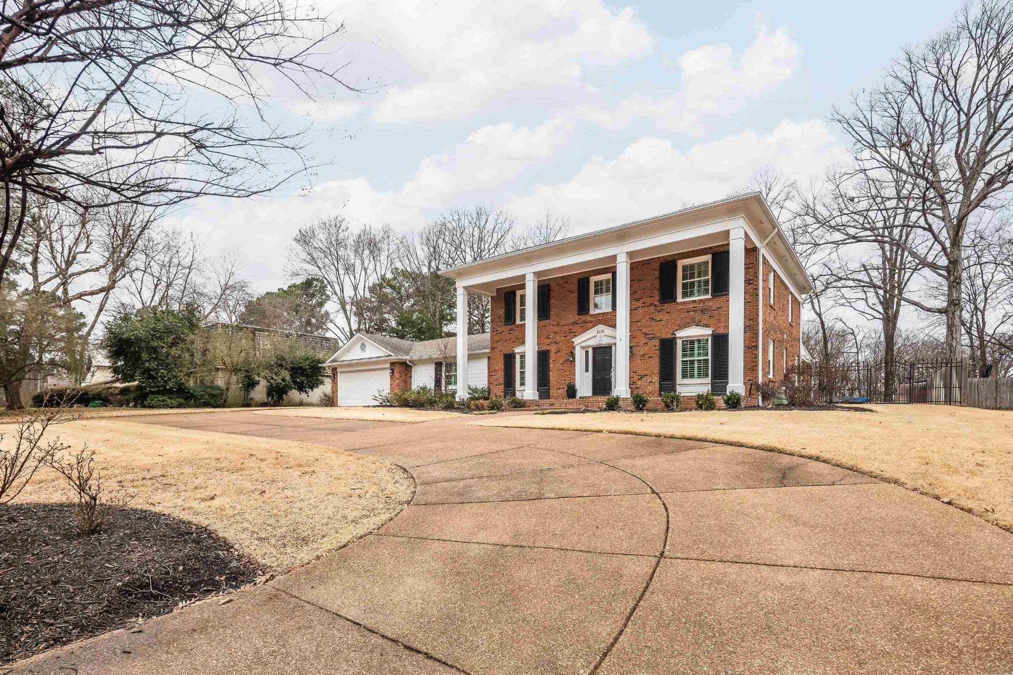 2115 Brierbrook Road Memphis, TN 38138 - Photo 3 of 40 a front view of house with yard and trees around