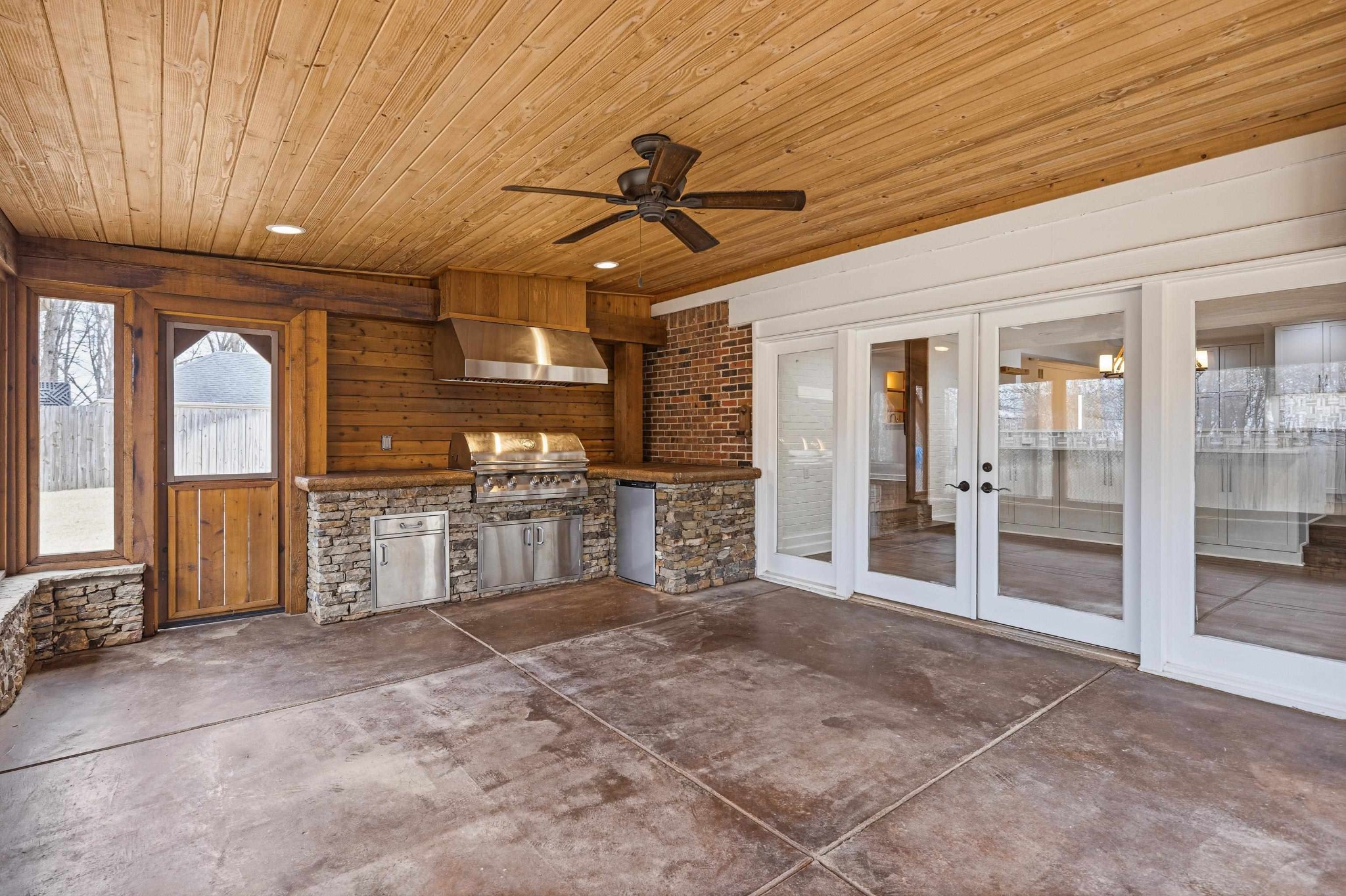 2115 Brierbrook Road Memphis, TN 38138 - Photo 32 of 40 a open kitchen with stainless steel appliances kitchen island granite countertop a refrigerator and cabinets