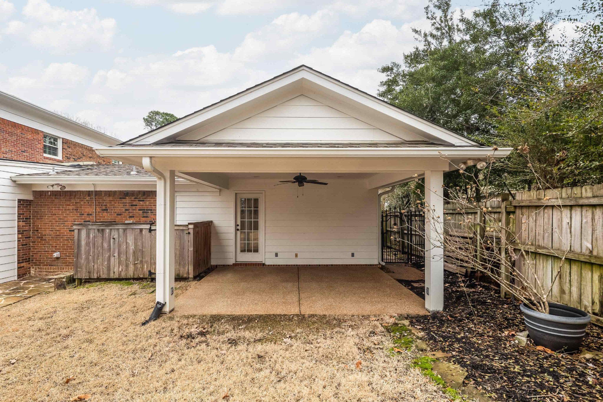 2115 Brierbrook Road Memphis, TN 38138 - Photo 36 of 40 a view of a house with a small yard and wooden fence