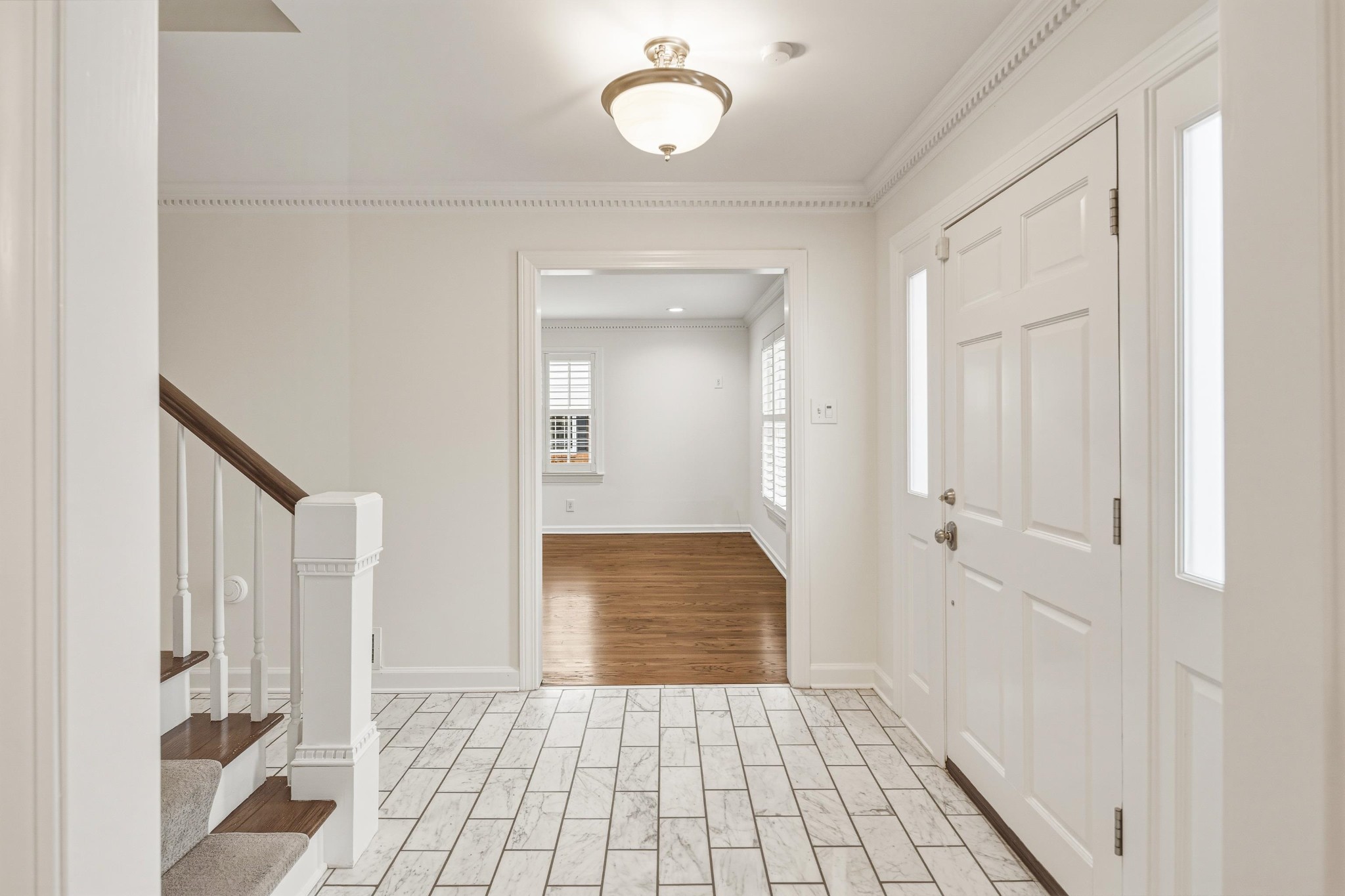 2115 Brierbrook Road Memphis, TN 38138 - Photo 5 of 40 a view of a hallway with wooden floor and a bathroom