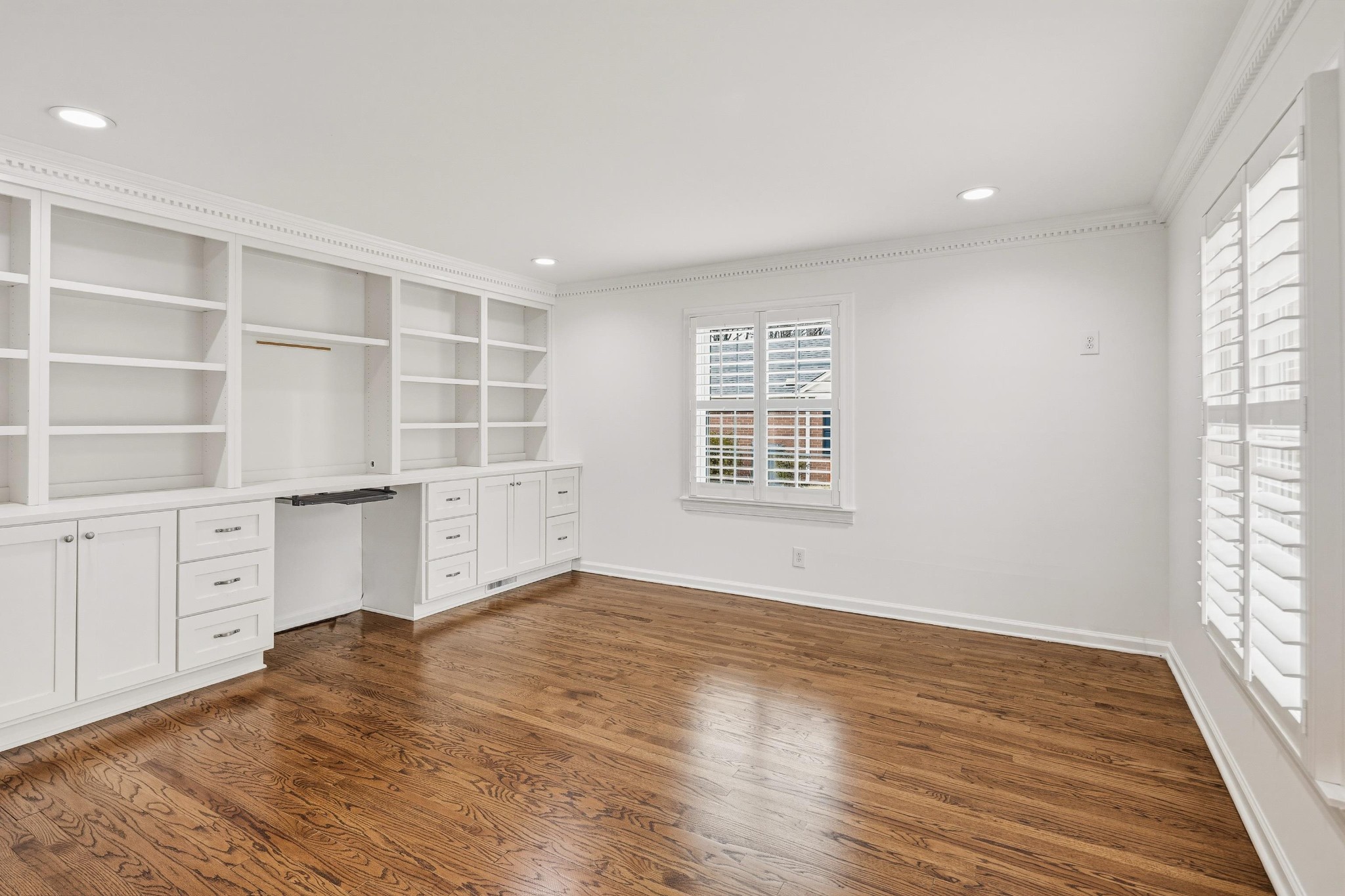 2115 Brierbrook Road Memphis, TN 38138 - Photo 7 of 40 an empty room with cabinet and windows